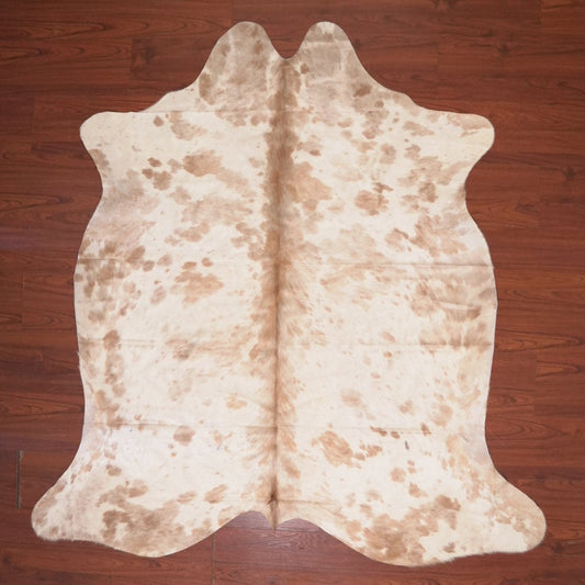 Cowhide rug on a wooden floor