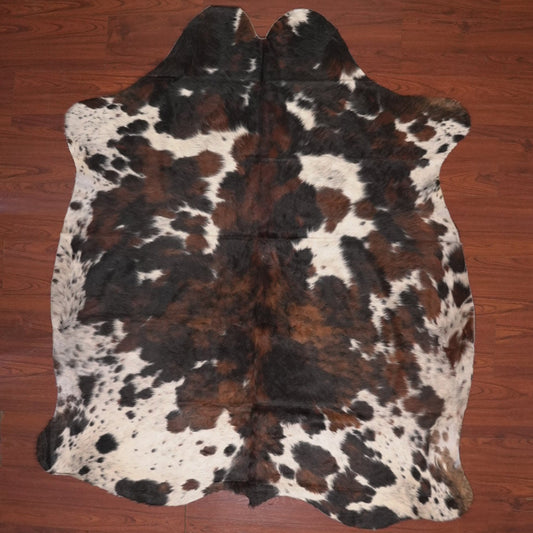 cow hide rug on wood floor