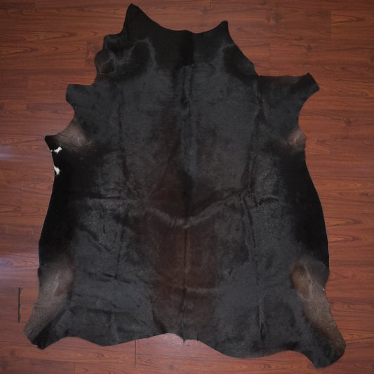 cowhide rug on wood floor