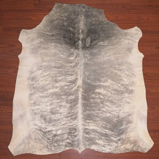 Cowhide rug on a wooden floor