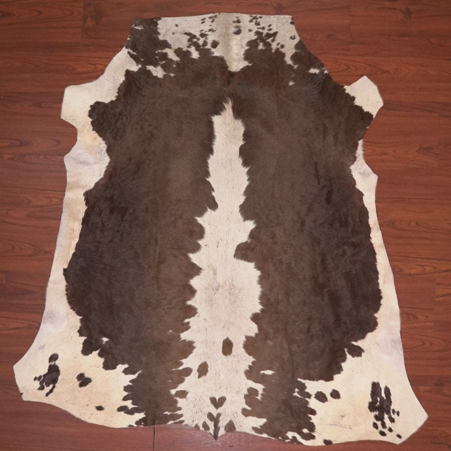 cow hide rug on wood floor