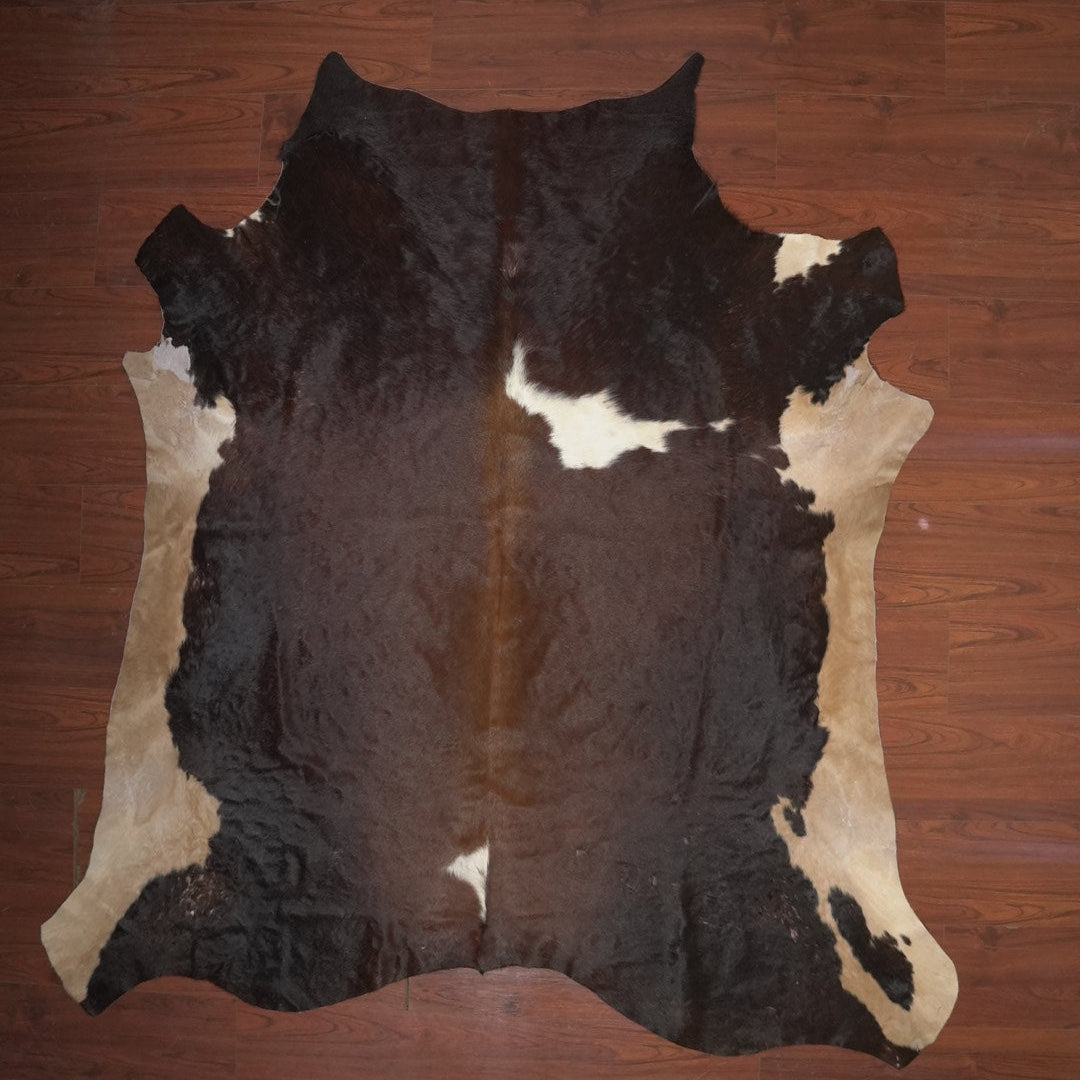 cow hide rug on wood floor