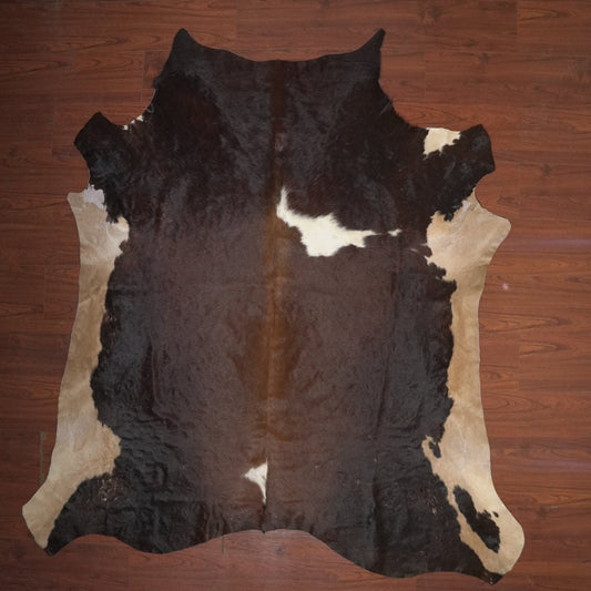 cow hide rug on wood floor