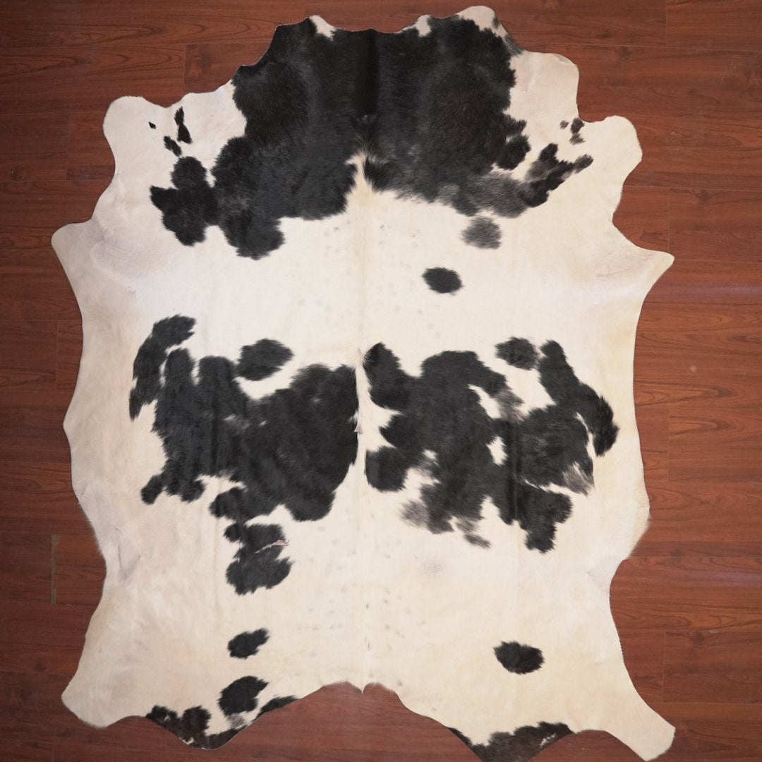 cow hide rug on wood floor