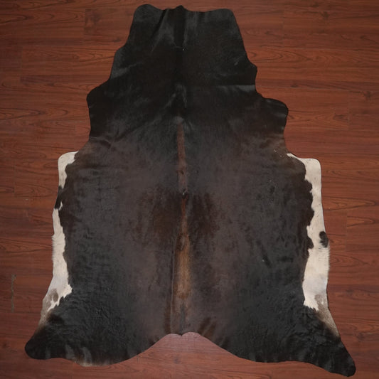 cow hide rug on wood floor