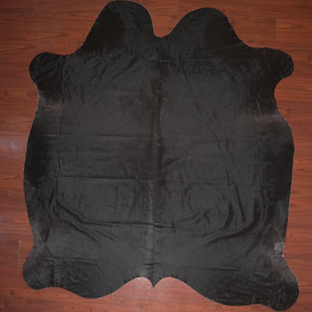 cow hide rug on wood floor