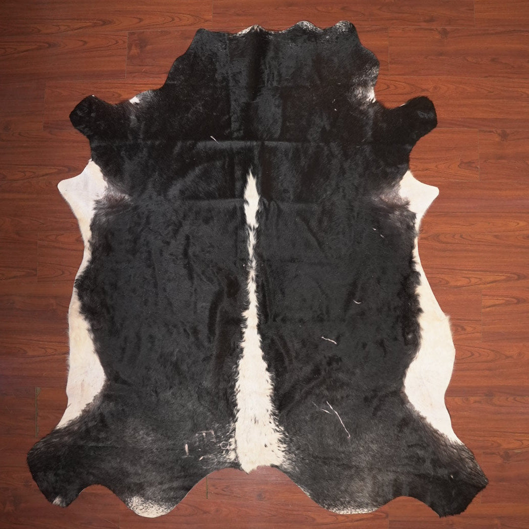 The Nguni Guy Nguni cowhide African decor Authentic cowhide Home decor Interior design Unique pattern Hand-selected Premium quality Natural beauty Exotic rug Genuine hide Statement piece Contemporary style Ethically sourced Sustainable decor Versatile accent Luxury rug Designer piece Modern aesthetic High-end craftsmanship Timeless elegance Designer home accents
