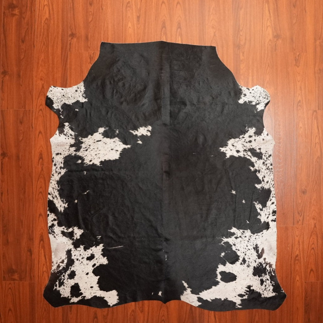 The Nguni Guy Black And White Solid Cowhide Skin Rug