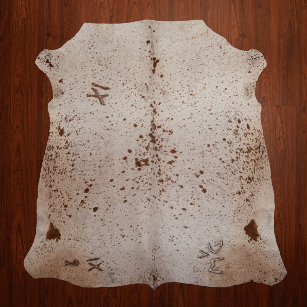 The Nguni Guy Brown and White speckled Nguni Cow Hide Rug 