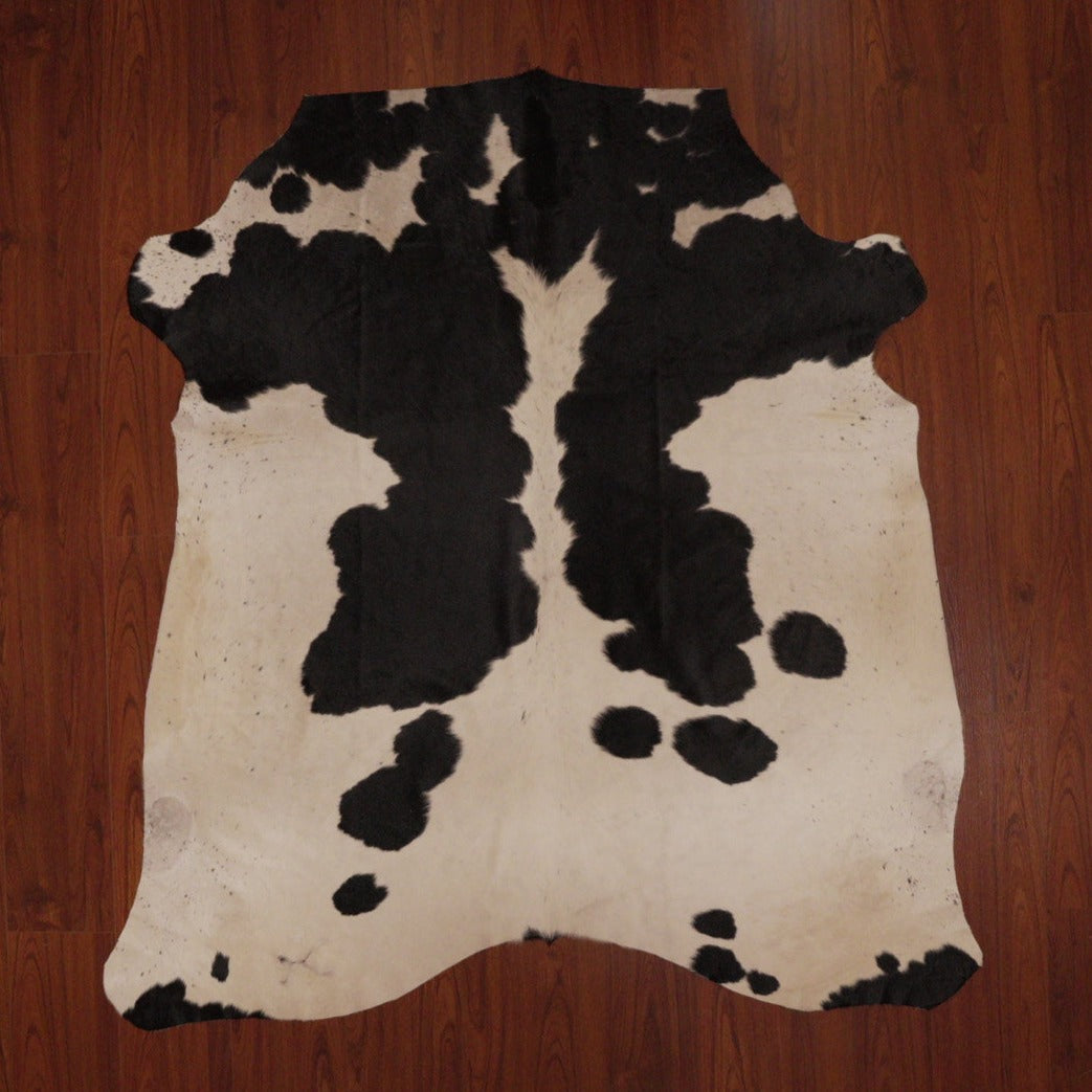 The Nguni Guy Nguni cowhide Black and white cowhide Speckled cowhide African decor Authentic cowhide Home decor Interior design Unique pattern Hand-selected Premium quality Natural beauty Exotic rug Genuine hide Statement piece Contemporary style Ethically sourced Sustainable decor Versatile accent Luxury rug Designer piece Modern aesthetic High-end craftsmanship Timeless elegance Designer home accents