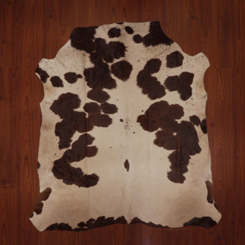 The Nguni Guy Nguni cowhide Black and white cowhide Speckled cowhide African decor Authentic cowhide Home decor Interior design Unique pattern Hand-selected Premium quality Natural beauty Exotic rug Genuine hide Statement piece Contemporary style Ethically sourced Sustainable decor Versatile accent Luxury rug Designer piece Modern aesthetic High-end craftsmanship Timeless elegance Designer home accents