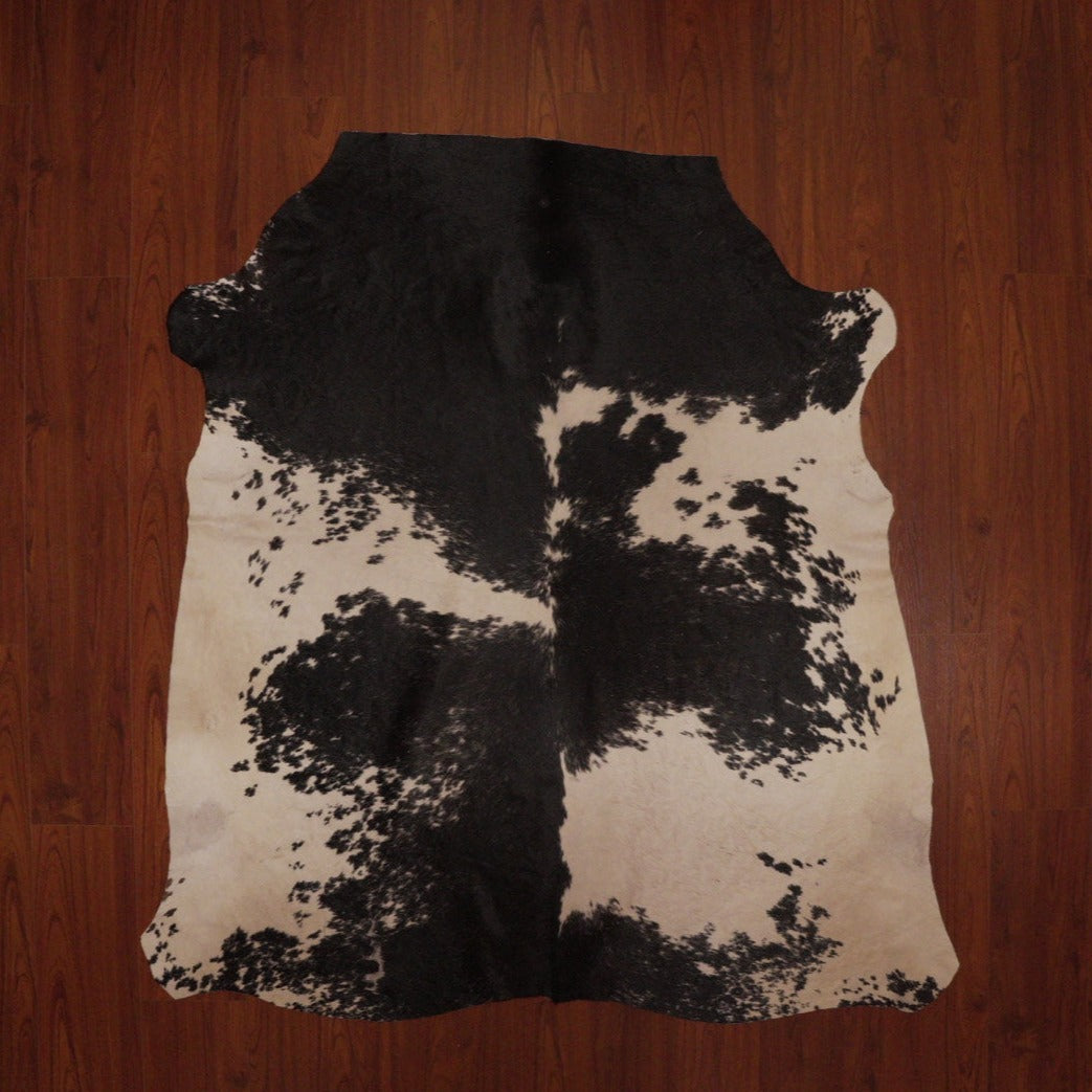 The Nguni Guy Nguni cowhide Black and white cowhide Speckled cowhide African decor Authentic cowhide Home decor Interior design Unique pattern Hand-selected Premium quality Natural beauty Exotic rug Genuine hide Statement piece Contemporary style Ethically sourced Sustainable decor Versatile accent Luxury rug Designer piece Modern aesthetic High-end craftsmanship Timeless elegance Designer home accents