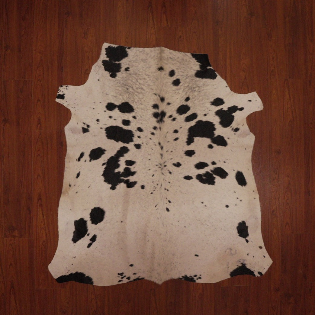 The Nguni Guy Nguni cowhide Black and white cowhide Speckled cowhide African decor Authentic cowhide Home decor Interior design Unique pattern Hand-selected Premium quality Natural beauty Exotic rug Genuine hide Statement piece Contemporary style Ethically sourced Sustainable decor Versatile accent Luxury rug Designer piece Modern aesthetic High-end craftsmanship Timeless elegance Designer home accents