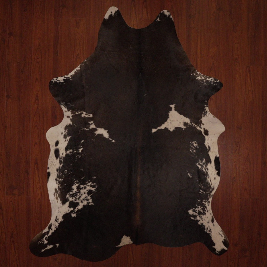 The Nguni Guy Nguni cowhide Black and white cowhide Speckled cowhide African decor Authentic cowhide Home decor Interior design Unique pattern Hand-selected Premium quality Natural beauty Exotic rug Genuine hide Statement piece Contemporary style Ethically sourced Sustainable decor Versatile accent Luxury rug Designer piece Modern aesthetic High-end craftsmanship Timeless elegance Designer home accents