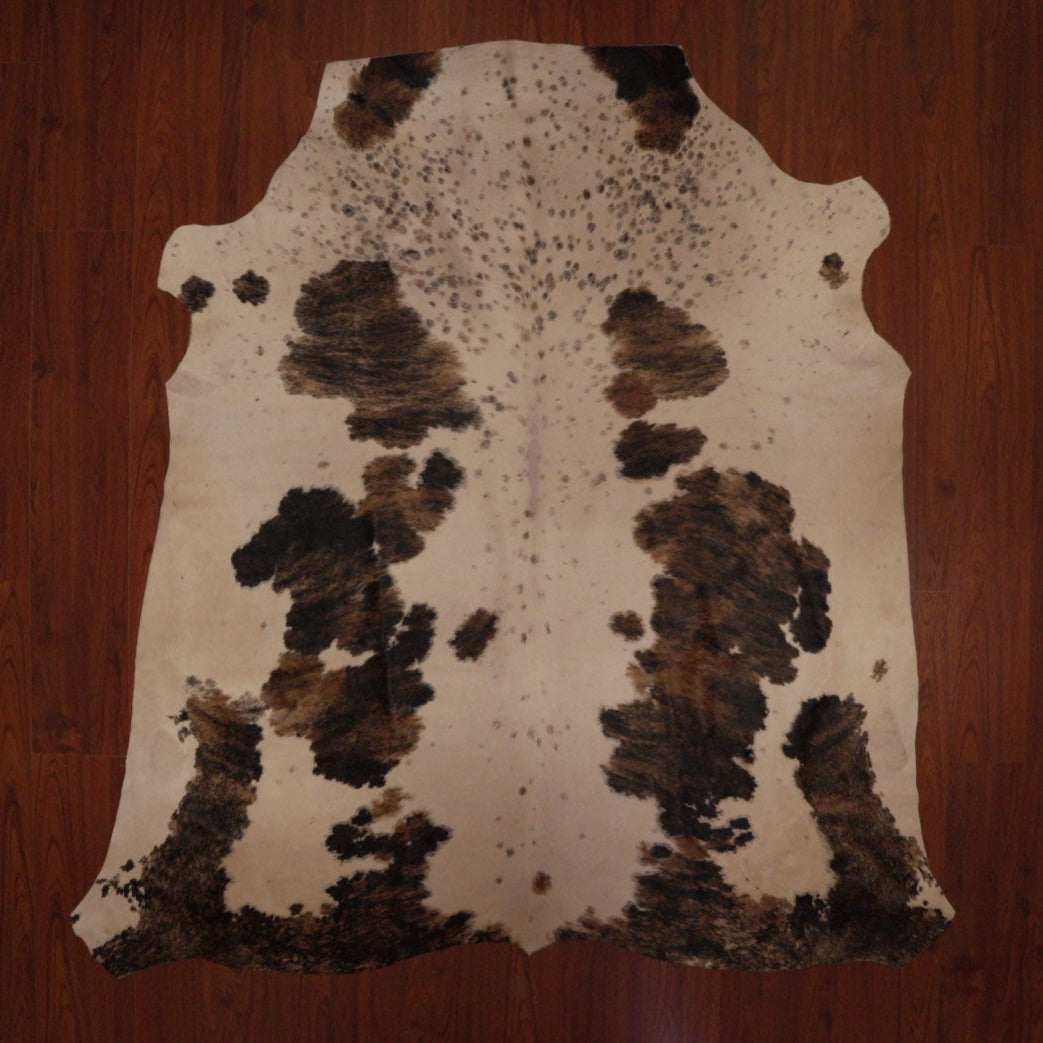 The Nguni Guy Nguni cowhide Tricolour cowhide Spotted cowhide African decor Authentic cowhide Home decor Interior design Unique pattern Hand-selected Premium quality Natural beauty Exotic rug Genuine hide Statement piece Contemporary style Ethically sourced Sustainable decor Versatile accent Luxury rug Designer piece Modern aesthetic High-end craftsmanship Timeless elegance Designer home accents