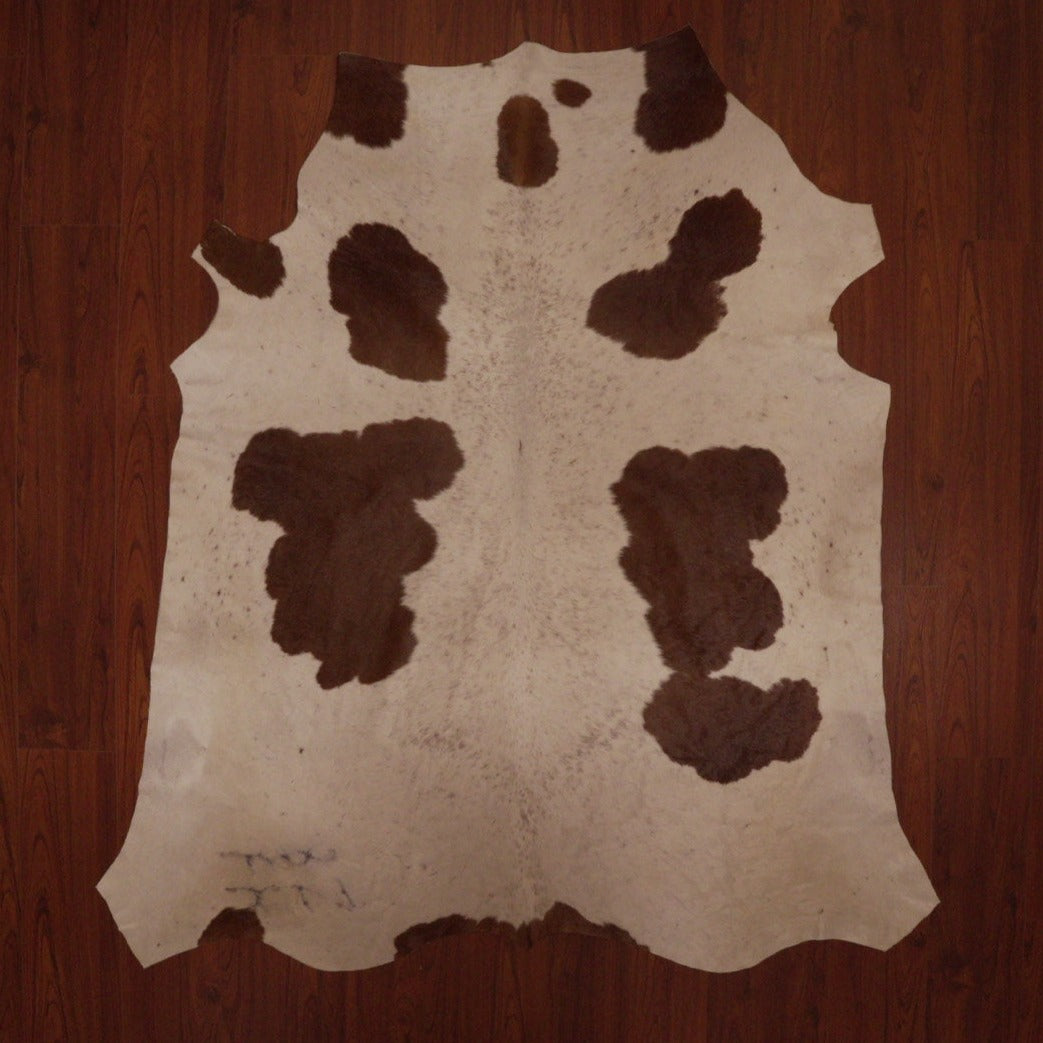 The Nguni Guy Nguni cowhide Brown and White cowhide Spotted cowhide African decor Authentic cowhide Home decor Interior design Unique pattern Hand-selected Premium quality Natural beauty Exotic rug Genuine hide Statement piece Contemporary style Ethically sourced Sustainable decor Versatile accent Luxury rug Designer piece Modern aesthetic High-end craftsmanship Timeless elegance Designer home accents