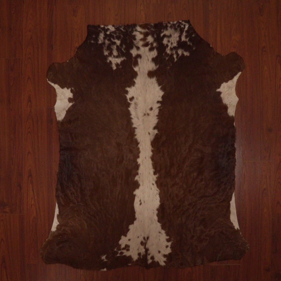 The Nguni Guy Nguni cowhide African decor Authentic cowhide Home decor Interior design Unique pattern Hand-selected Premium quality Natural beauty Exotic rug Genuine hide Statement piece Contemporary style Ethically sourced Sustainable decor Versatile accent Luxury rug Designer piece Modern aesthetic High-end craftsmanship Timeless elegance Designer home accents
