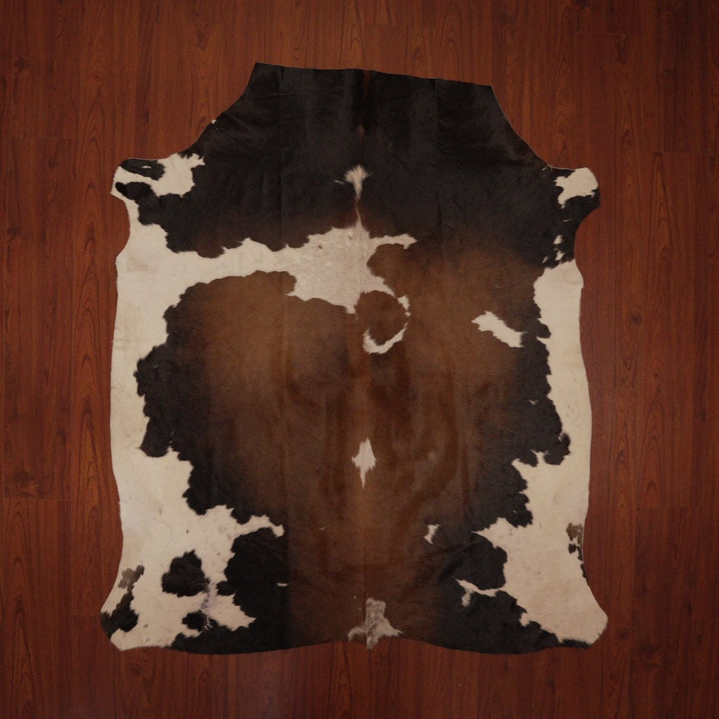 The Nguni Guy Nguni cowhide African decor Authentic cowhide Home decor Interior design Unique pattern Hand-selected Premium quality Natural beauty Exotic rug Genuine hide Statement piece Contemporary style Ethically sourced Sustainable decor Versatile accent Luxury rug Designer piece Modern aesthetic High-end craftsmanship Timeless elegance Designer home accents