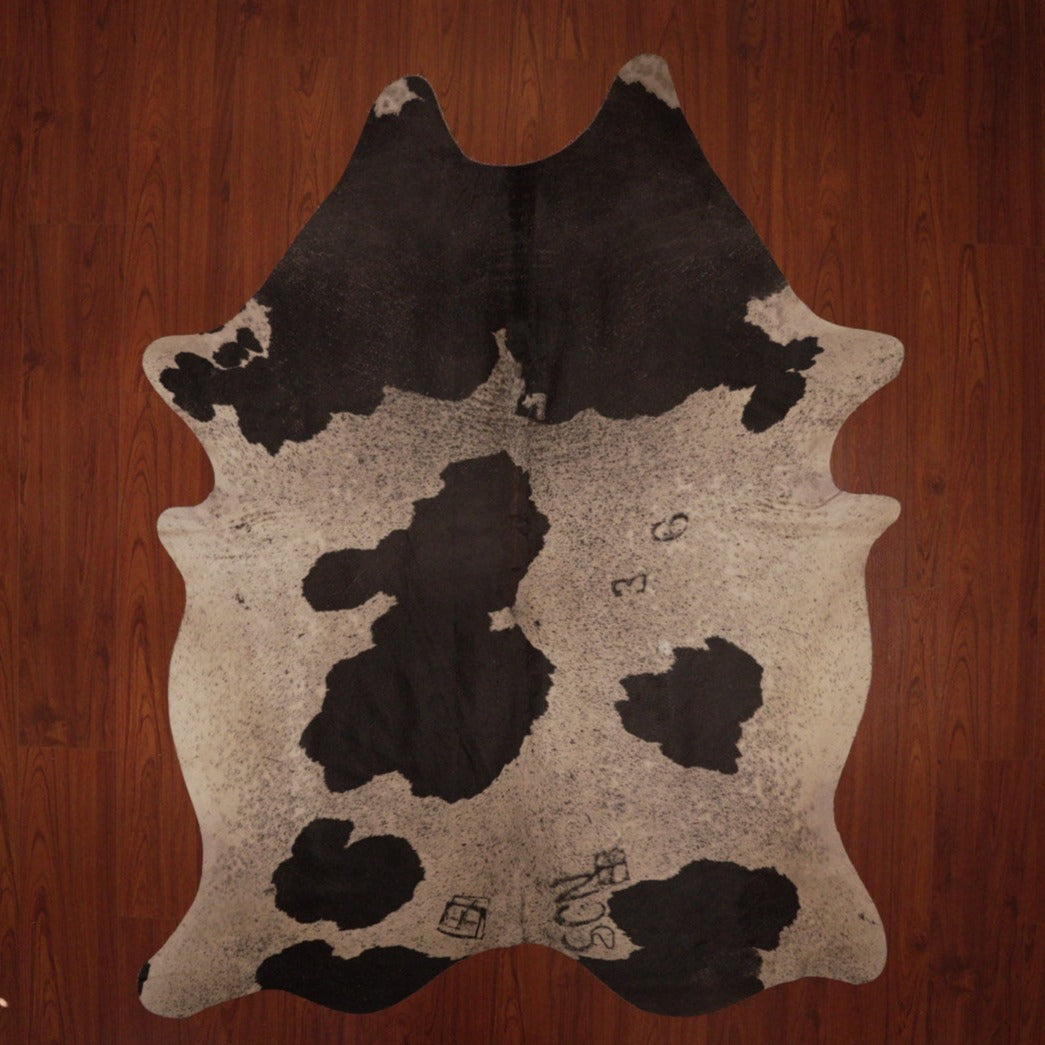 The Nguni Guy Nguni cowhide African decor Authentic cowhide Home decor Interior design Unique pattern Hand-selected Premium quality Natural beauty Exotic rug Genuine hide Statement piece Contemporary style Ethically sourced Sustainable decor Versatile accent Luxury rug Designer piece Modern aesthetic High-end craftsmanship Timeless elegance Designer home accents