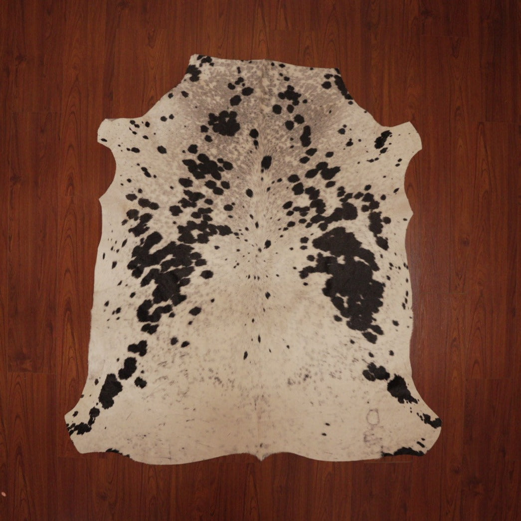 The Nguni Guy Nguni cowhide African decor Authentic cowhide Home decor Interior design Unique pattern Hand-selected Premium quality Natural beauty Exotic rug Genuine hide Statement piece Contemporary style Ethically sourced Sustainable decor Versatile accent Luxury rug Designer piece Modern aesthetic High-end craftsmanship Timeless elegance Designer home accents