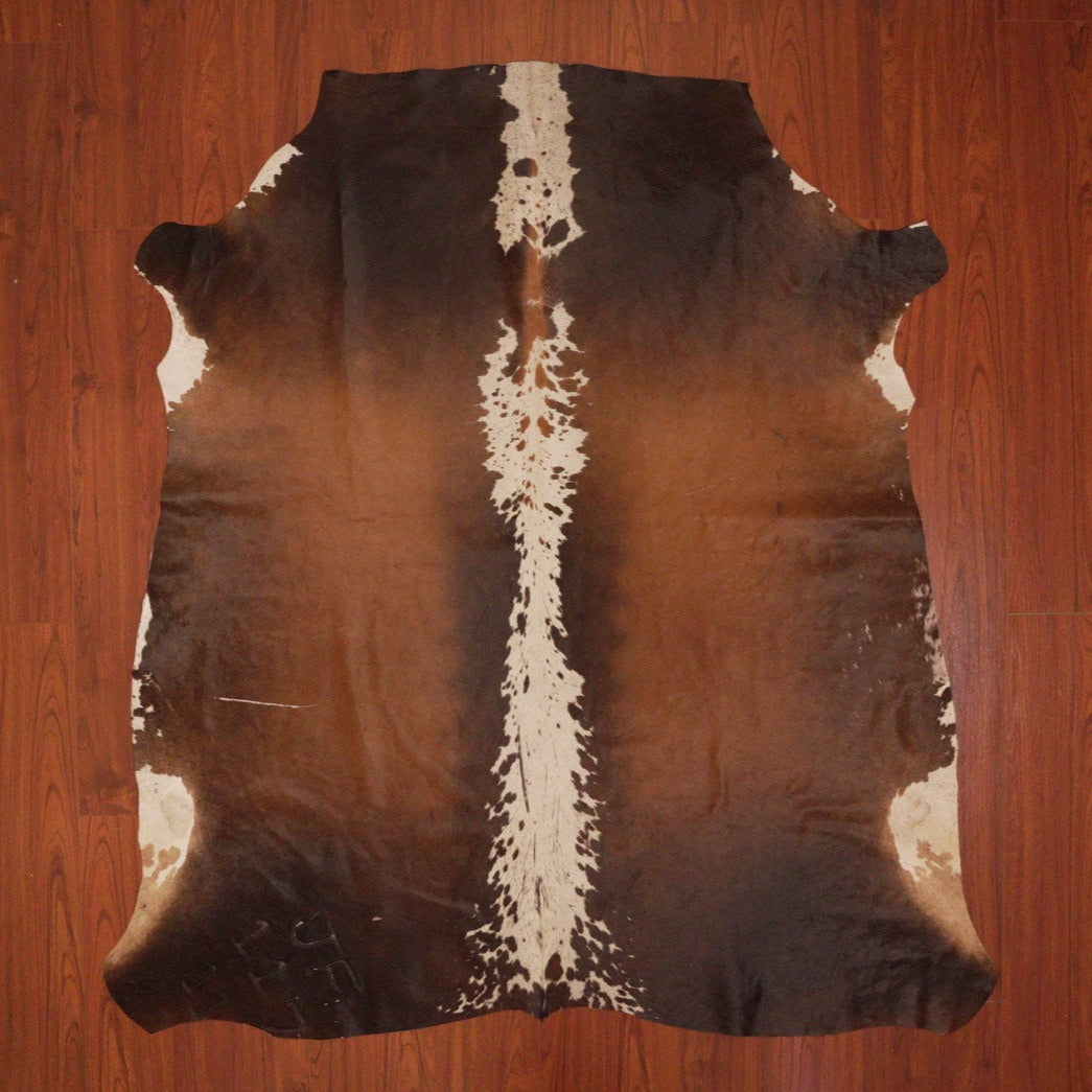 The Nguni Guy Nguni cowhide African decor Authentic cowhide Home decor Interior design Unique pattern Hand-selected Premium quality Natural beauty Exotic rug Genuine hide Statement piece Contemporary style Ethically sourced Sustainable decor Versatile accent Luxury rug Designer piece Modern aesthetic High-end craftsmanship Timeless elegance Designer home accents