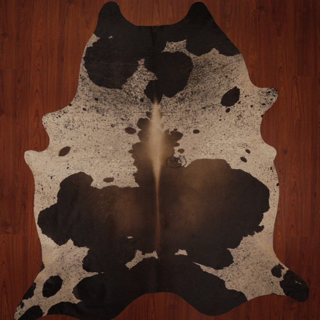 The Nguni Guy Nguni cowhide African decor Authentic cowhide Home decor Interior design Unique pattern Hand-selected Premium quality Natural beauty Exotic rug Genuine hide Statement piece Contemporary style Ethically sourced Sustainable decor Versatile accent Luxury rug Designer piece Modern aesthetic High-end craftsmanship Timeless elegance Designer home accents